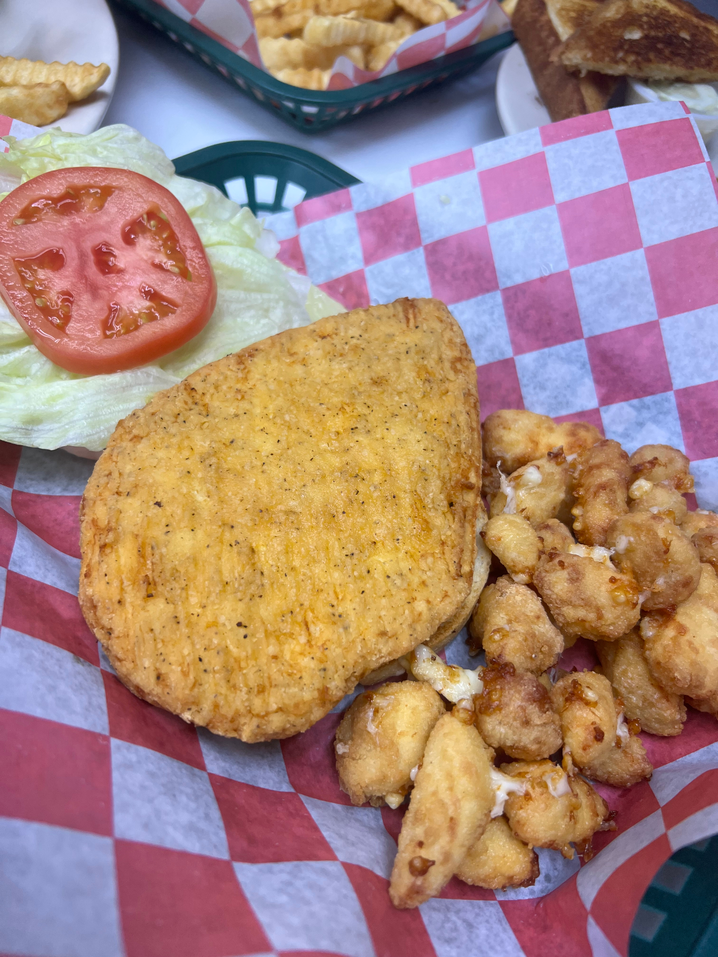 Fried chicken sandwich with a side of fresh Wisconsin cheese curds