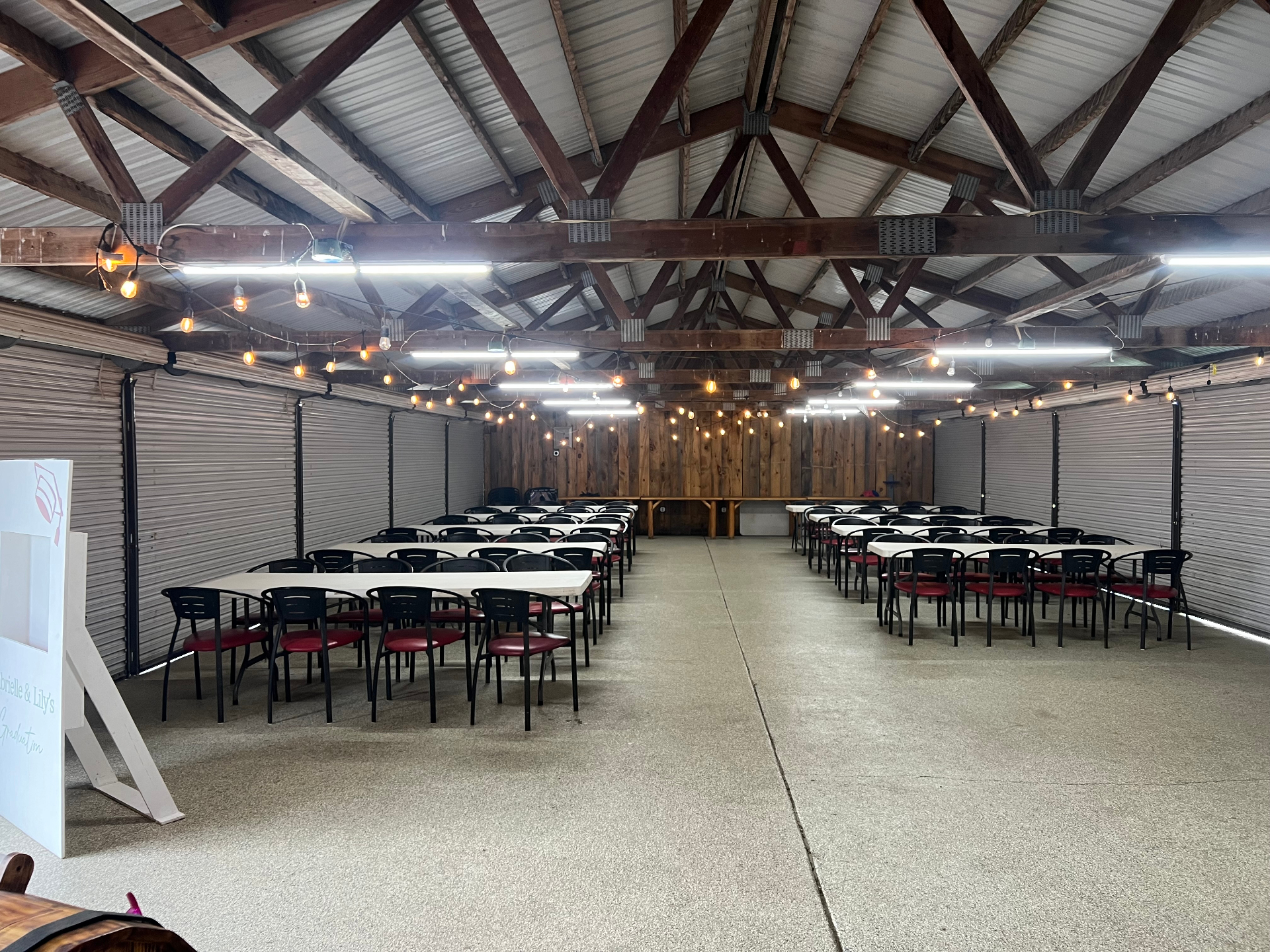 Long tables set up inside The Party Shed